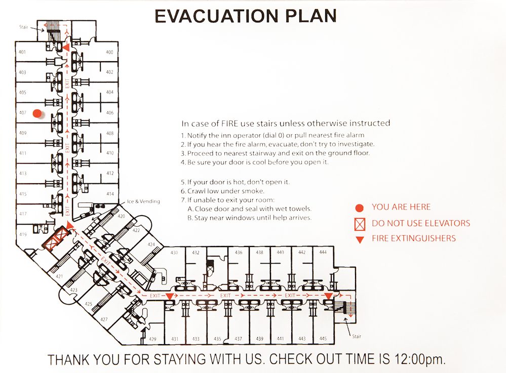 This is an image of a basic hotel floor evacuation map with exits, fire routes, and 'You Are Here' markers.